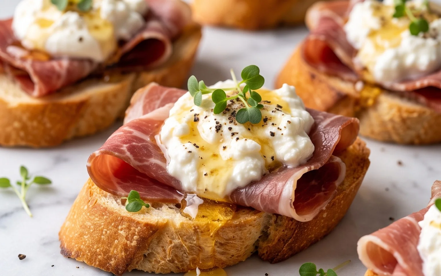 Beef Prosciutto Crostini with Burrata and Lemon Honey Drizzle